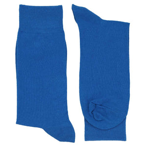 Pair of men's blue dress socks folded flat