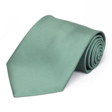 Load image into Gallery viewer, A eucalyptus green solid tie, rolled to show off the color