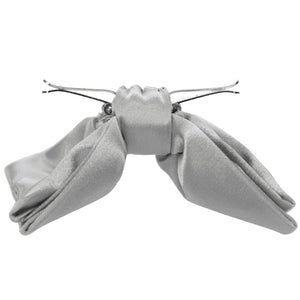 Side view of an opened mercury silver clip-on bow tie