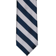 Load image into Gallery viewer, Front view of a navy blue and silver striped tie, laid out flat
