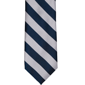 Front view of a navy blue and silver striped tie, laid out flat