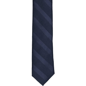 The front of a navy blue tone-on-tone striped tie, laid out flat