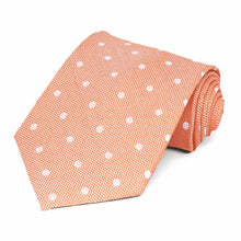 Load image into Gallery viewer, An orange and white polka dot necktie, rolled to show texture