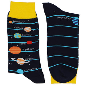 A pair of solar system socks, with planets on a black and yellow background