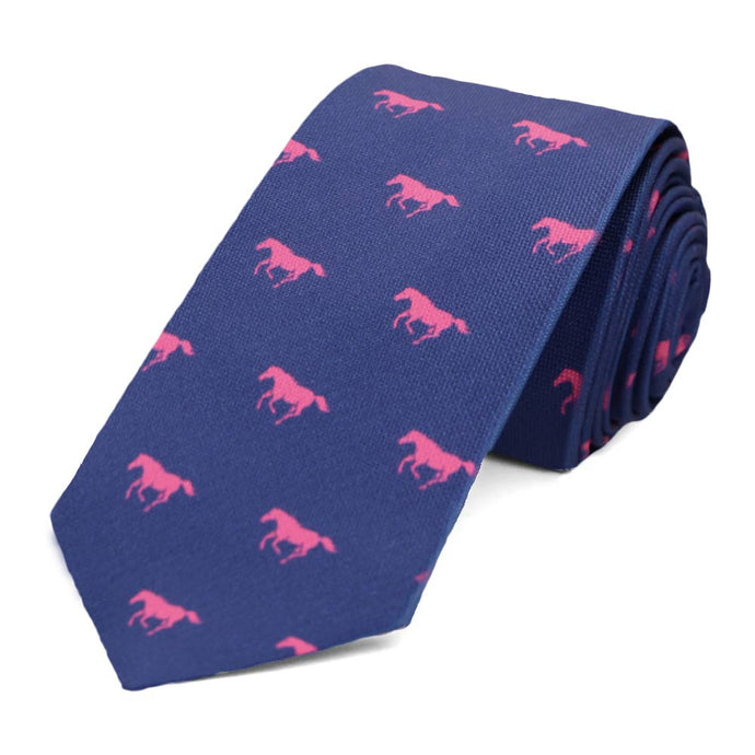 A pink and blue horse themed slim tie, rolled to show off the design