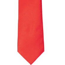 Load image into Gallery viewer, The front of a poppy red solid tie, laid out flat