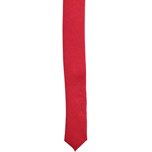 Button tabs on the tail of a red uniform tie