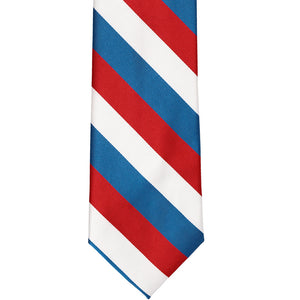 The front of a red, white and medium blue striped tie, laid out flat
