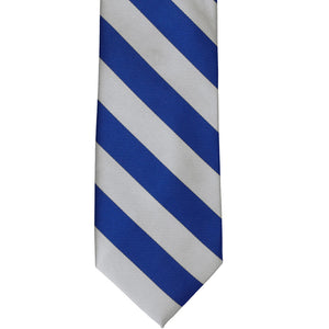 Front of a royal blue and silver striped tie, laid out flat