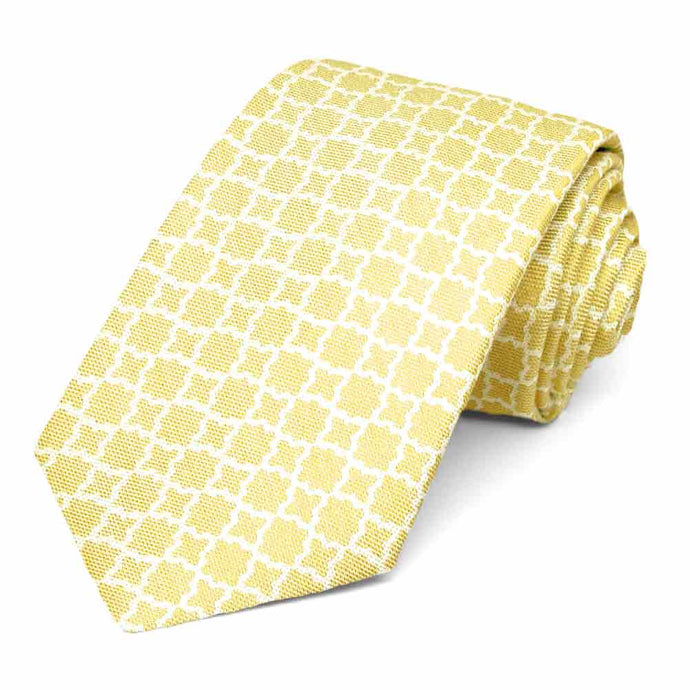 Soft yellow tie with a white trellis pattern, rolled to show texture