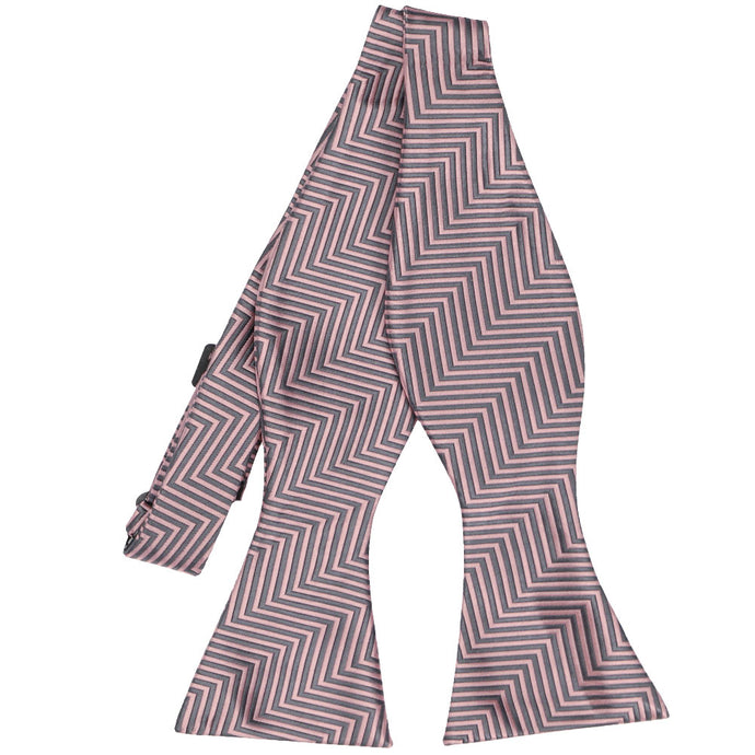 Front view of an untied pink and gray chevron pattern self-tie bow tie