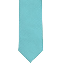 Load image into Gallery viewer, The front of a turquoise herringbone tie, laid out flat