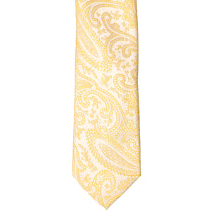 Front tip of a yellow paisley slim tie