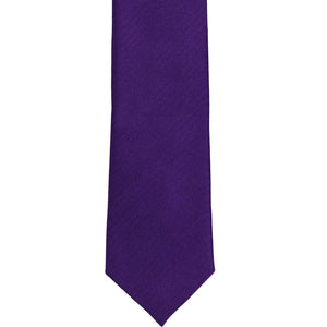 The front of an amethyst purple slim herringbone tie, laid out flat