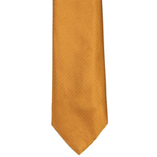 Load image into Gallery viewer, A close-up of a textured antique gold herringbone necktie on a solid white background.