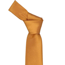Load image into Gallery viewer, An antique gold necktie with a subtle herringbone pattern, styled in a knot and shown against a plain white background.