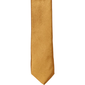 The front of an antique gold skinny tie, laid flat