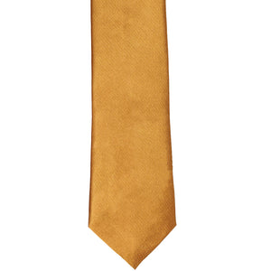 The front of an antique gold slim tie, laid out flat
