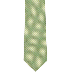 The front of an apple green tie with a circle pattern, laid flat