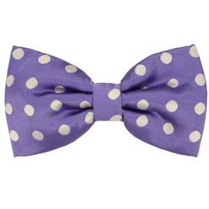 A lighter purple pre-tied bow tie with tan polka dots