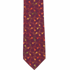 The front of a burgundy tie with an all-over leaf pattern