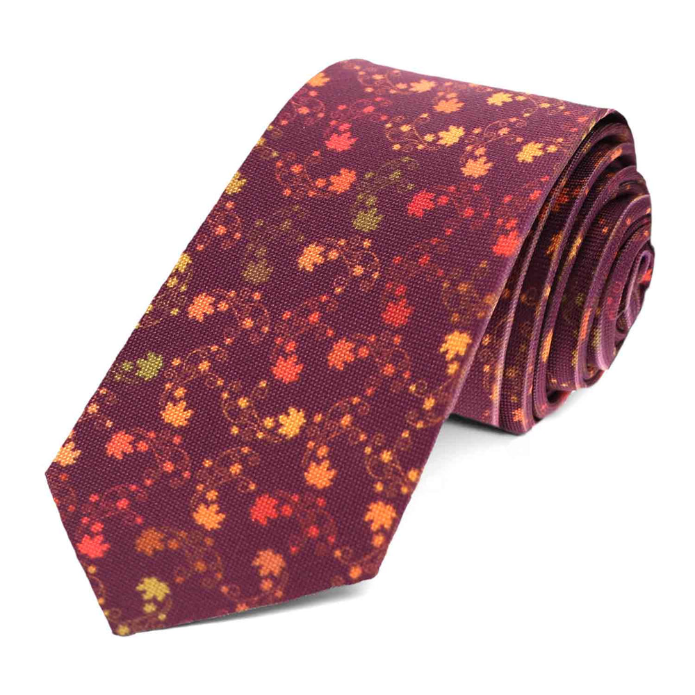 A burgundy slim tie with an all over fall eaf pattern