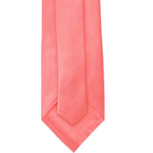 Load image into Gallery viewer, Back of a coral-colored tie on a white background