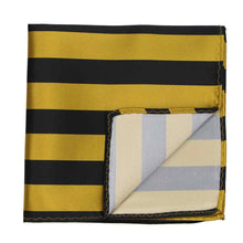 Load image into Gallery viewer, A black and gold striped pocket square, folded with a corner up to show backside