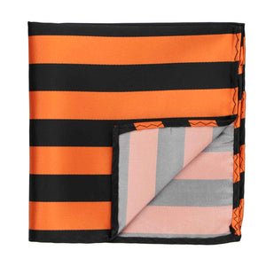 A black and orange striped pocket square with the corner flipped up to show back