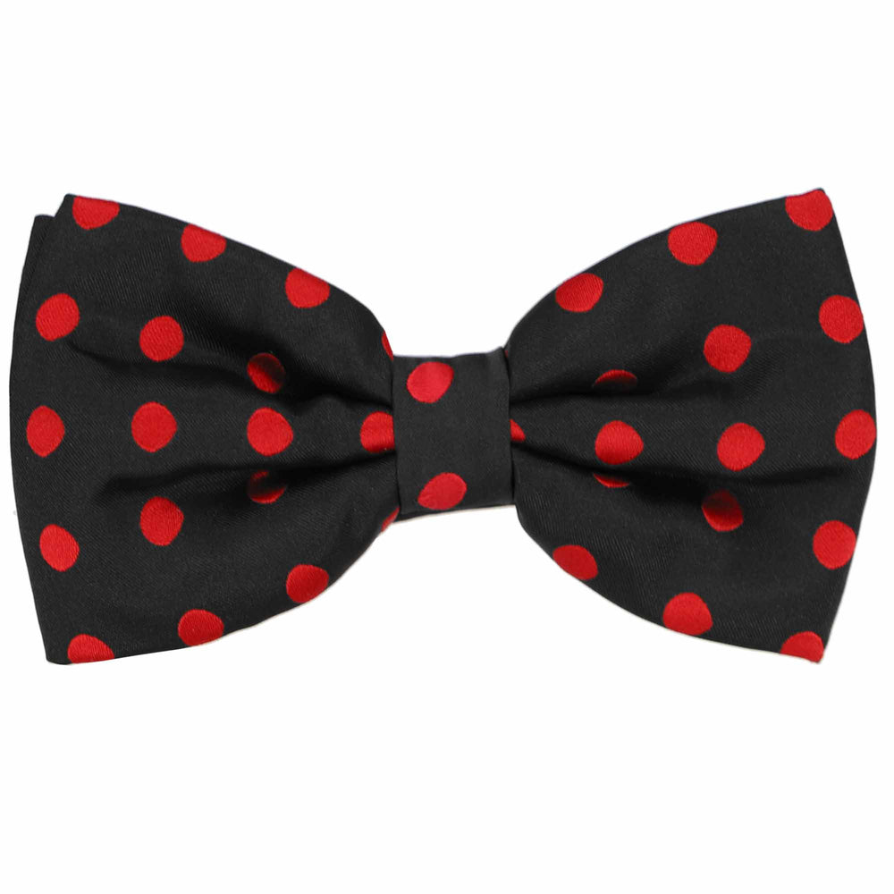 A black bow tie with red polka dots