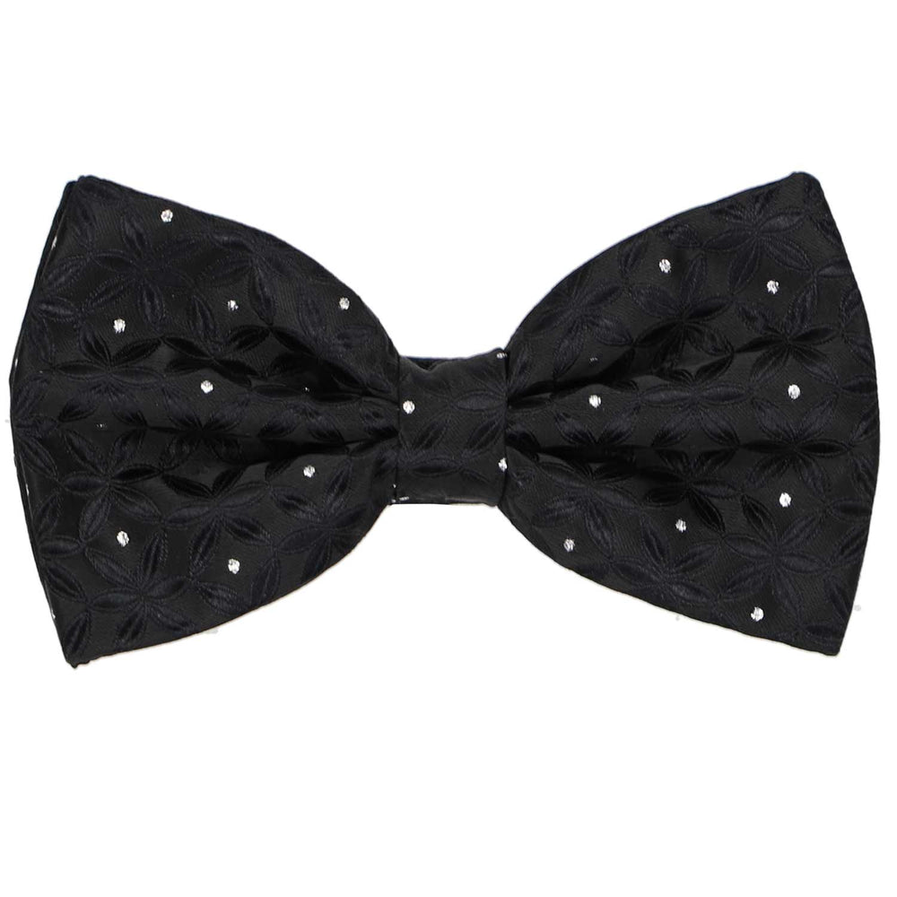A black pre-tied textured bow tie with silver metallic polka dots