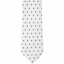 Load image into Gallery viewer, The front of a white and black polka dot necktie