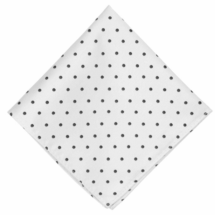 A white pocket square with black polka dots