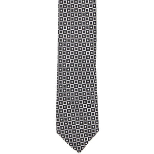 The front of a black and white square and diamond pattern skinny tie
