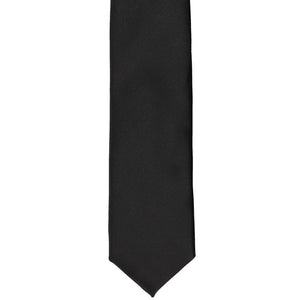 The front of a black skinny tie, laid flat
