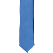 Load image into Gallery viewer, The front of a blue solid skinny tie, laid flat