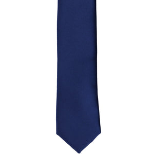 The front of a blue velvet skinny tie, laid out flat