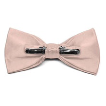 Load image into Gallery viewer, The back of a blush pink solid color clip-on bow tie, showing the two metal clips