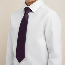 Load image into Gallery viewer, Boy wearing an eggplant purple tie with a white dress shirt against a beige background