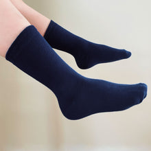 Load image into Gallery viewer, A boy wearing navy blue crew socks