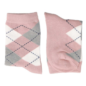 A pair of folded blush pink argyle socks
