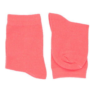 A pair of boys coral solid dress socks, folded over