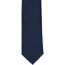 Load image into Gallery viewer, The front of a boys&#39; navy blue solid tie, laid flat