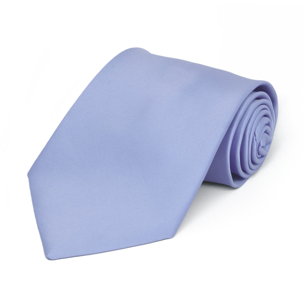 A boys' periwinkle tie, rolled to show off the front and color