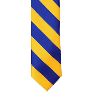 The front of a royal blue and golden yellow striped tie