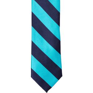 The front bottom of a navy blue and turquoise striped tie