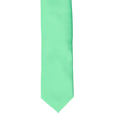 Load image into Gallery viewer, The front of a bright mint skinny tie, laid flat