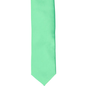 The front of a bright mint skinny tie, laid flat