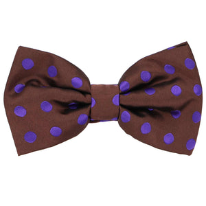 A brown pre-tied bow tie with purple polka dots