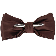 Load image into Gallery viewer, The back of a pre-tied brown clip-on bow tie with a silver metal bar clasp, displayed flat against a solid white background.